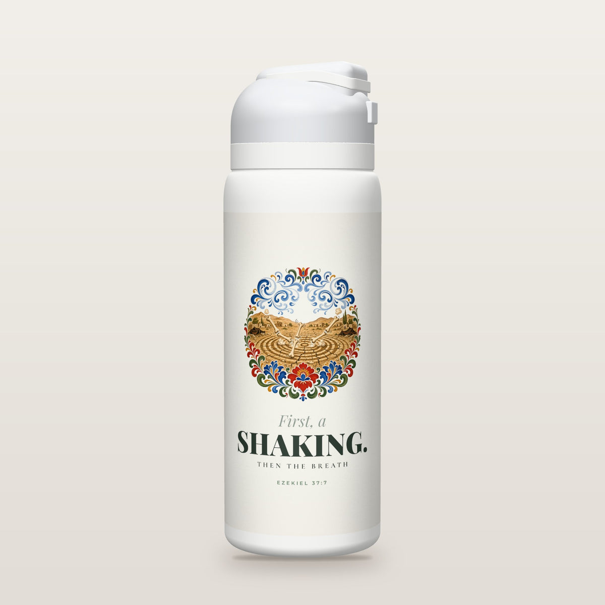 White Owala water bottle with a soft off-white printed band, a hand-painted folk-art illustration of a cracked desert valley shaking in ripple rings as dry bones click together, with swirling blue wind curls waiting above and folk flowers around it, the words First, a SHAKING., and Ezekiel 37:7 with the meaning of the Hebrew word for shaking.