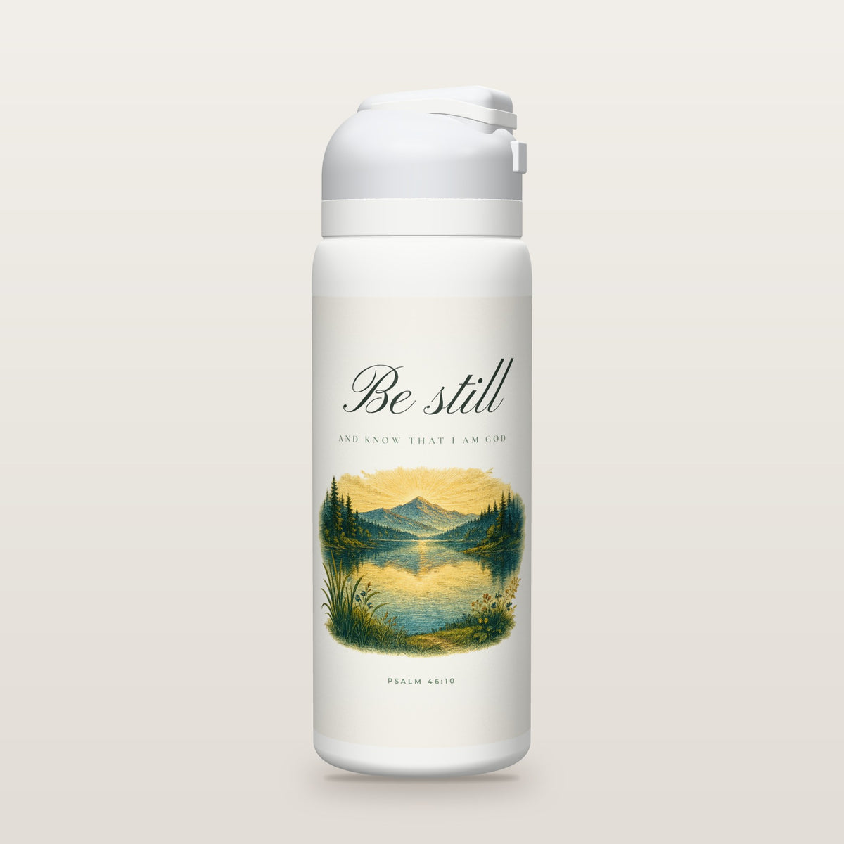 White Owala water bottle with a soft white printed band, the script words Be still above a hand-painted engraving of a still mountain lake at dawn, Psalm 46:10.