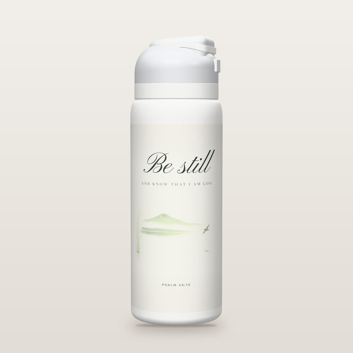 White Owala water bottle with a soft white printed band, the script words Be still above a quiet watercolor lake, Psalm 46:10.