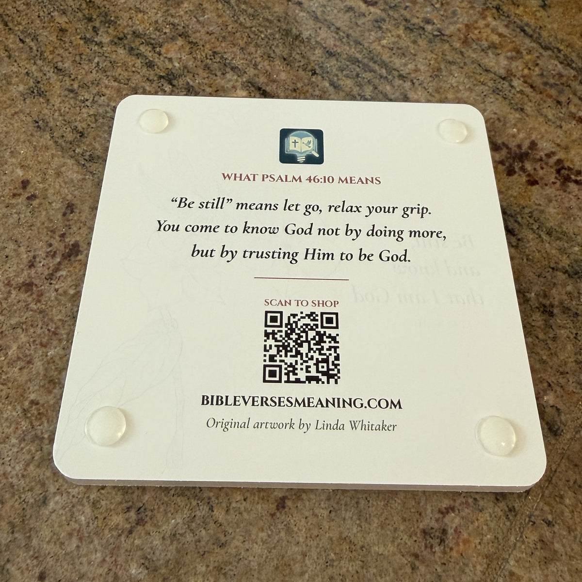 Photo of the back of the Psalm 46:10 coaster: what the verse means, QR code and clear feet