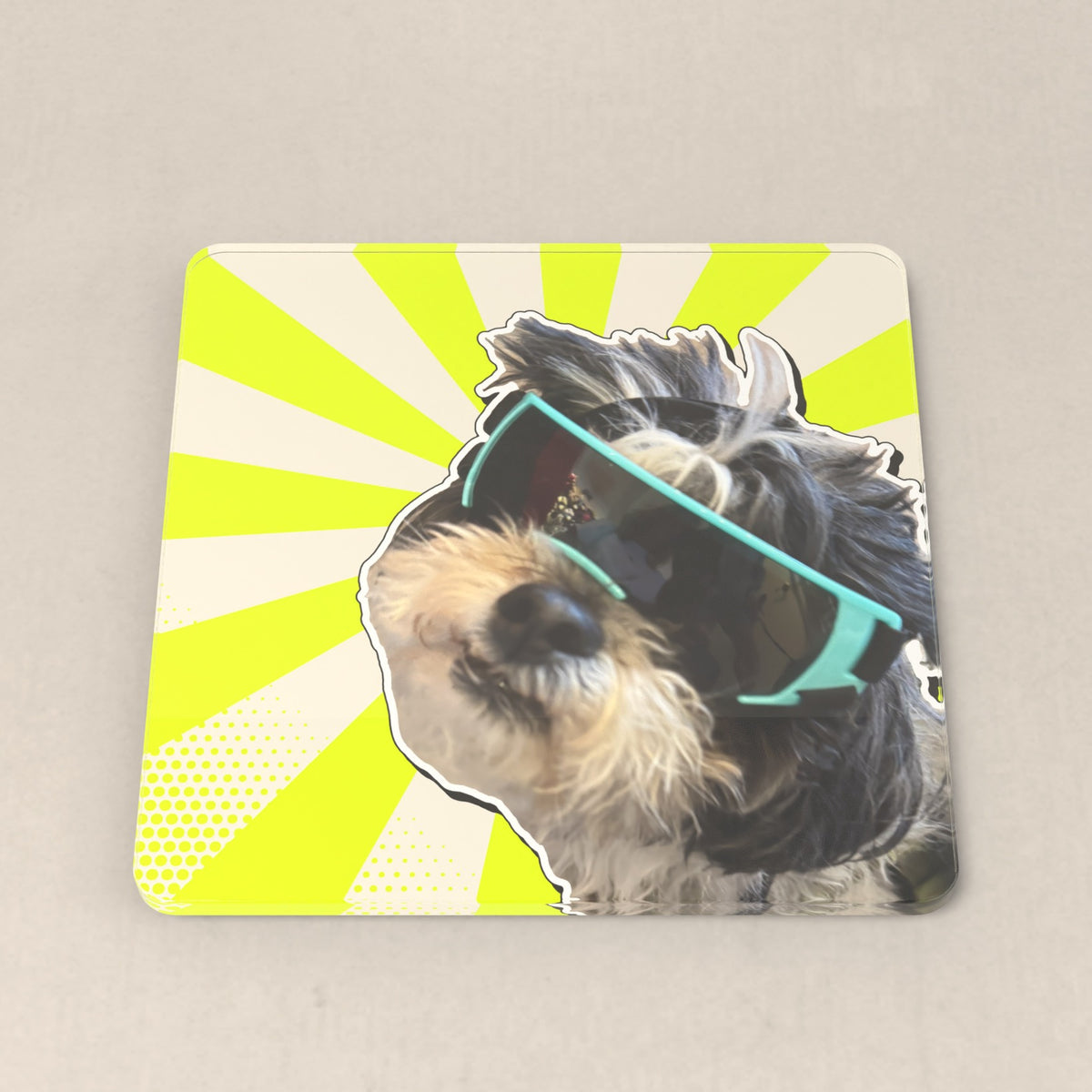 Style: Photo only. Alonso in teal goggles on a neon sunburst coaster, no name