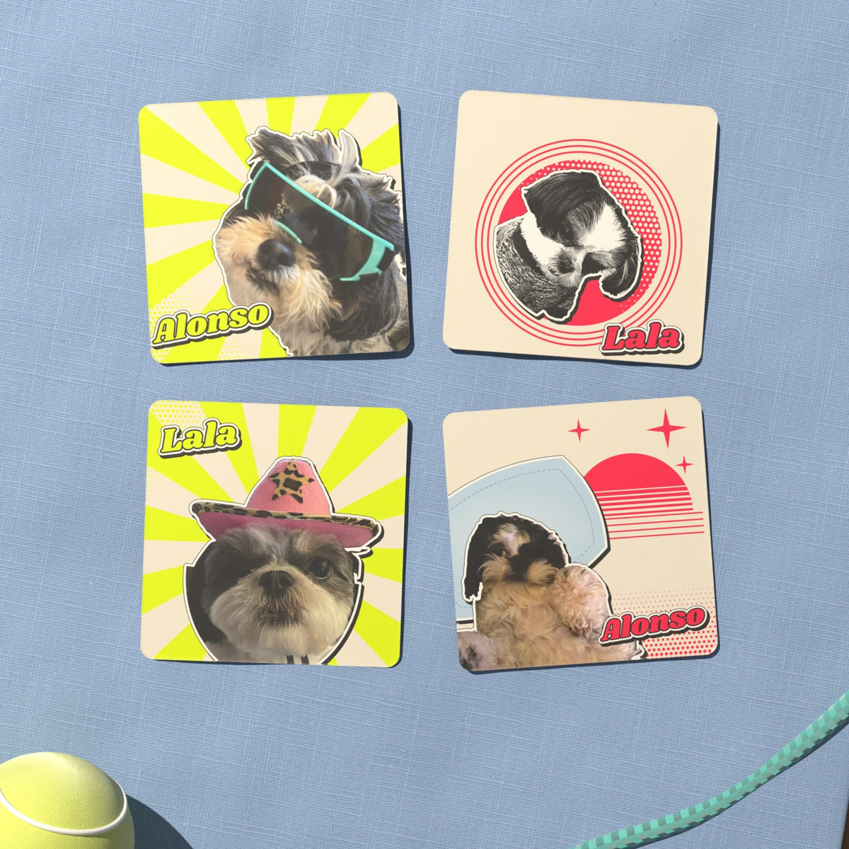 A second set of four retro pet coasters on blue linen, with the names Alonso and Lala in retro lettering: Alonso in teal goggles, Lala in a sweater as a black-and-white sketch, Lala in a pink cowboy hat, and Alonso lying on a pillow under a sunset