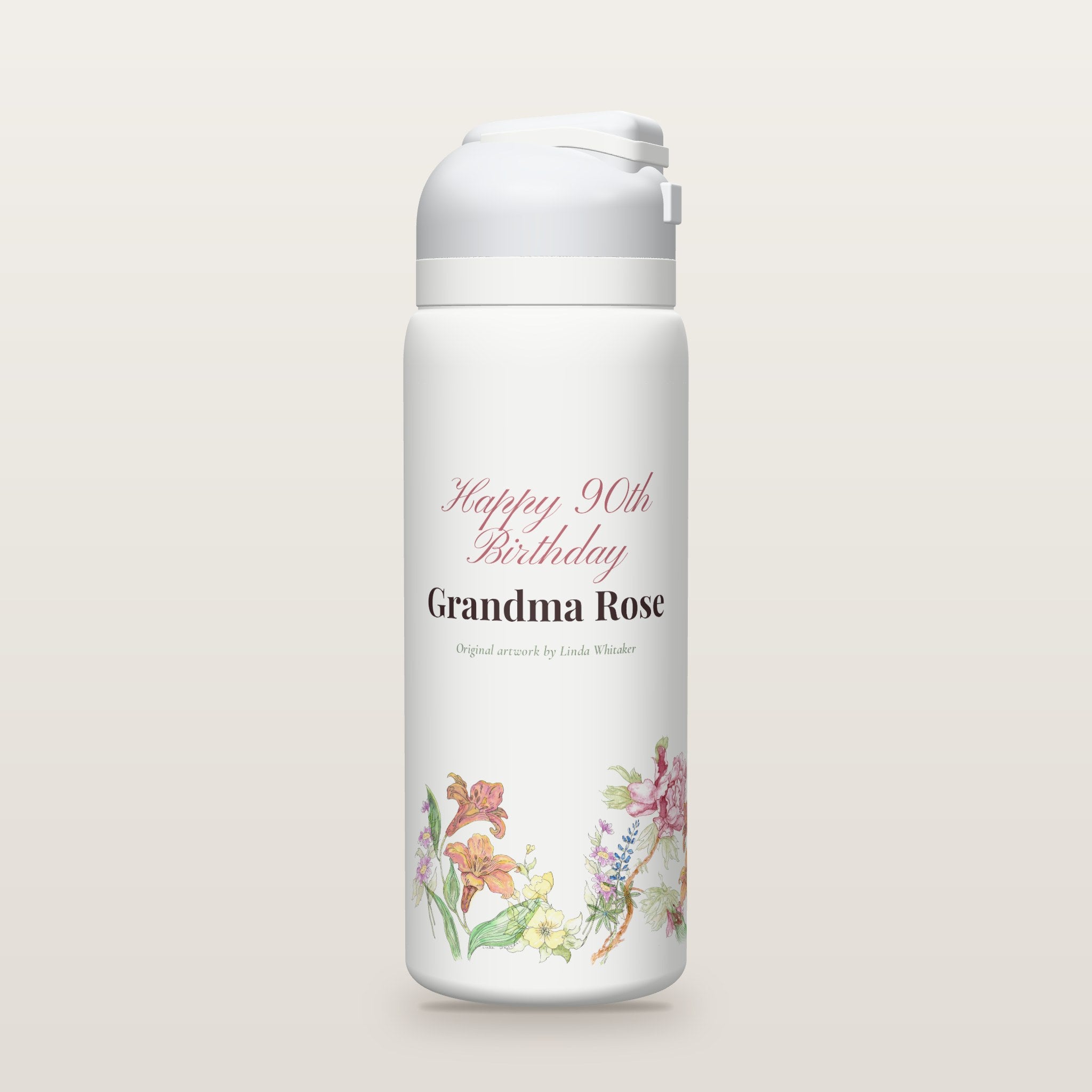 White Owala water bottle with a border of watercolor garden flowers by Linda Whitaker under Happy 90th Birthday Grandma Rose (a sample name and age).